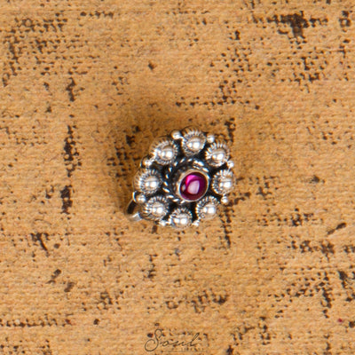 Round flower with gemstone