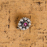 Round flower with gemstone