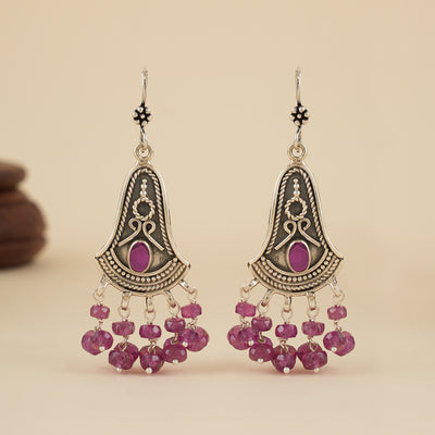 Oxidised silver earrings with intricate detailing and hanging ruby beads
