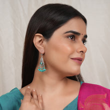 Load image into Gallery viewer, Model Wearing Oxidised silver earrings with intricate detailing and hanging turquoise beads